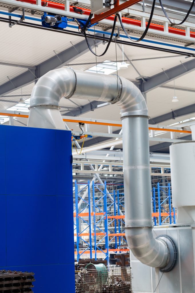 Industrial photography of big ventilation pipe on modern automatic factory or warehouse
